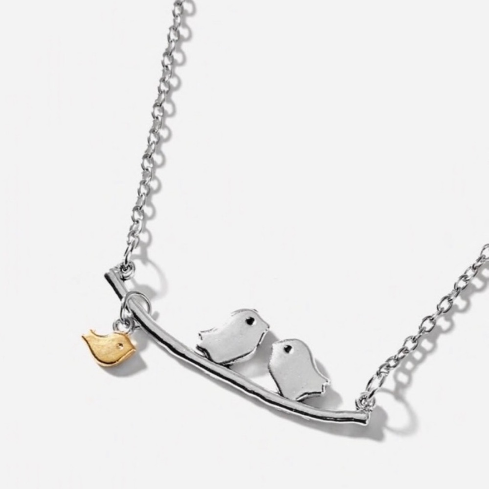 Silver and gold tone birds on a perch necklace